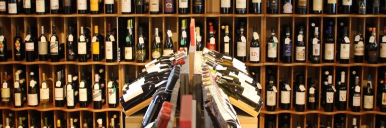 the secret cellar forest row bottles 768x256